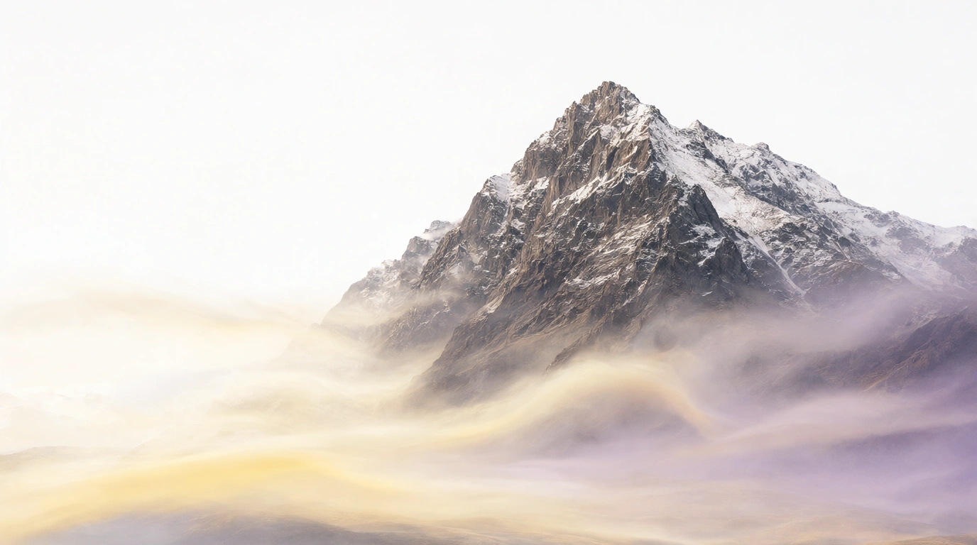 A snow-capped summit rising over golden and violet mist
